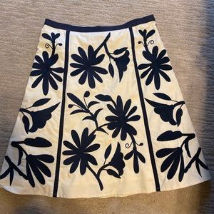 Navy and white Tory Burch skirt. Below the knee.